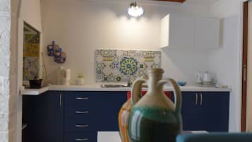 Apartment, 1 Bedroom | Private kitchenette | Fridge, stovetop, coffee/tea maker, electric kettle