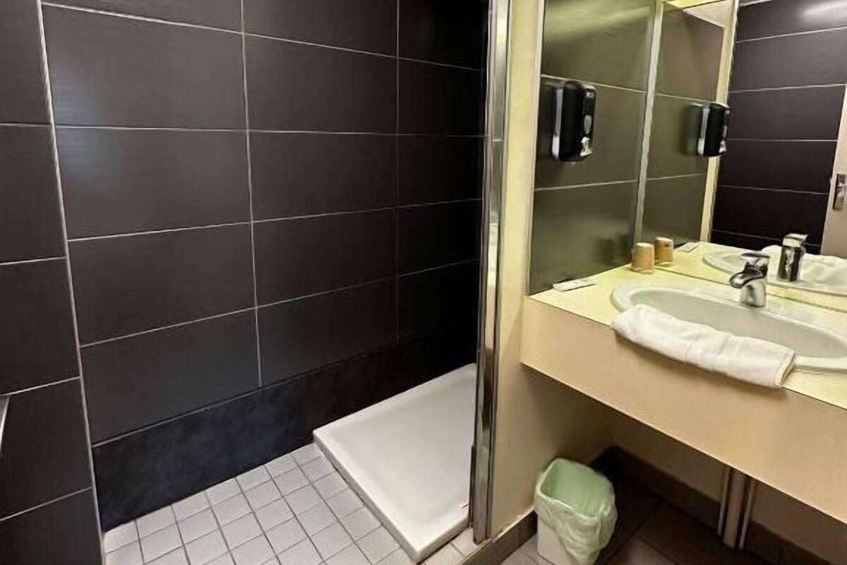 comfort triple room, multiple beds | bathroom | free toiletries, hair dryer, towels, soap