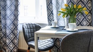 Studio (1 Hyacinth) | Living area | Flat-screen TV - Grace Apartments (Kraków)