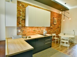 Family Apartment, 1 Bedroom (18) | Living area | 45-inch flat-screen TV with cable channels, TV - K12 Apartments (Kraków)