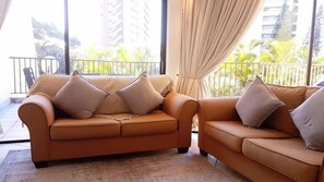 Executive Apartment, 3 Bedrooms | Living room | Flat-screen TV, DVD player