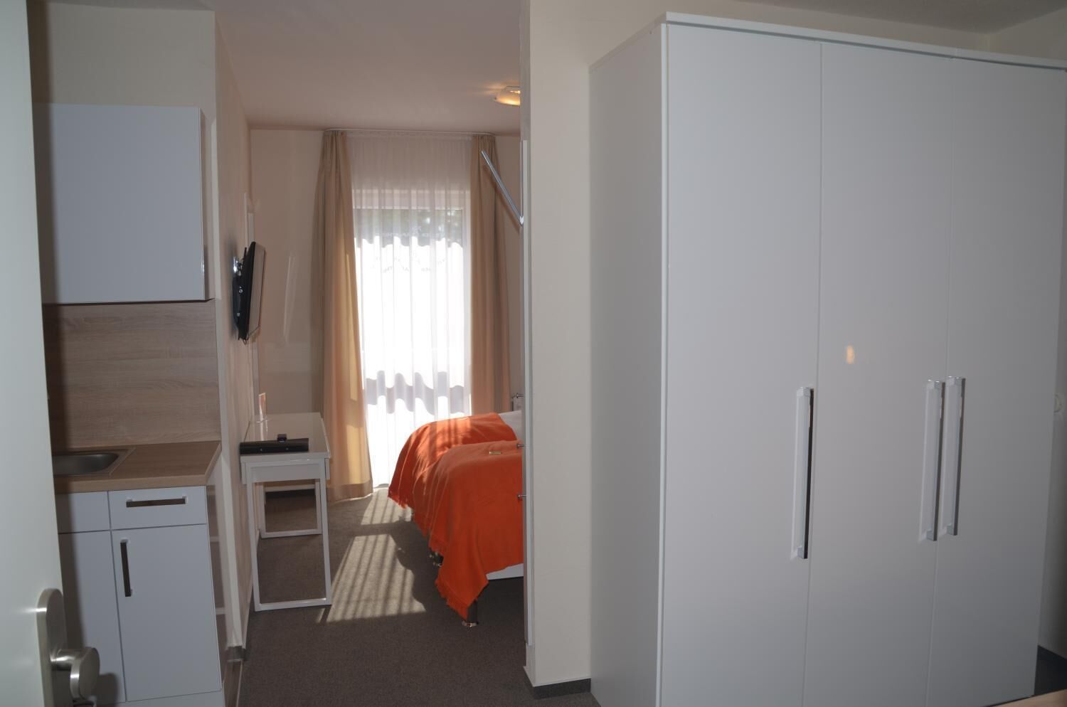 hypo-allergenic bedding, desk, blackout curtains, soundproofing