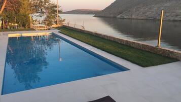 Seasonal outdoor pool, pool umbrellas, pool loungers