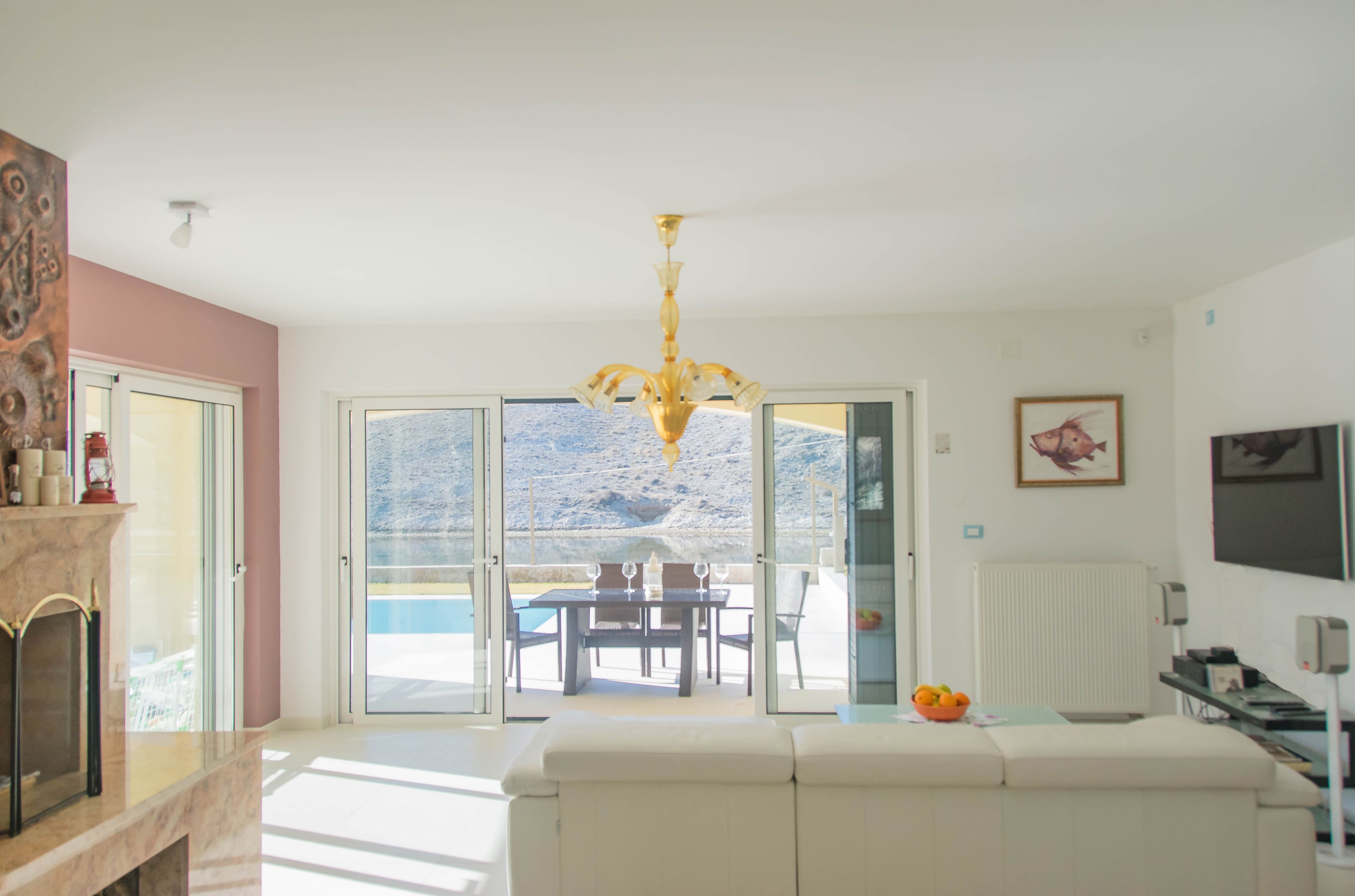 Villa, Sea View | Living area | Flat-screen TV, fireplace