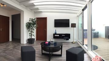 Apartment, 2 Bedrooms, Balcony | Living area | Smart TV