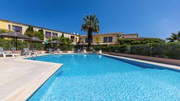 Seasonal outdoor pool, open 10:00 AM to 8:00 PM, pool umbrellas