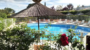 Seasonal outdoor pool, pool umbrellas, pool loungers