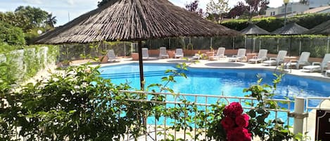 Seasonal outdoor pool, pool umbrellas, pool loungers