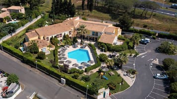 Relax by the pool surrounded by sun loungers and umbrellas in our central courtyard.