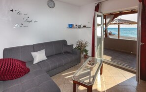 Superior Apartment | Living area | Flat-screen TV