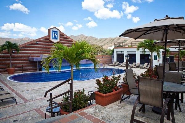 Outdoor pool, open 9:00 AM to 10:00 PM, pool umbrellas, pool loungers