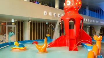 A children's play area with slides and water features.