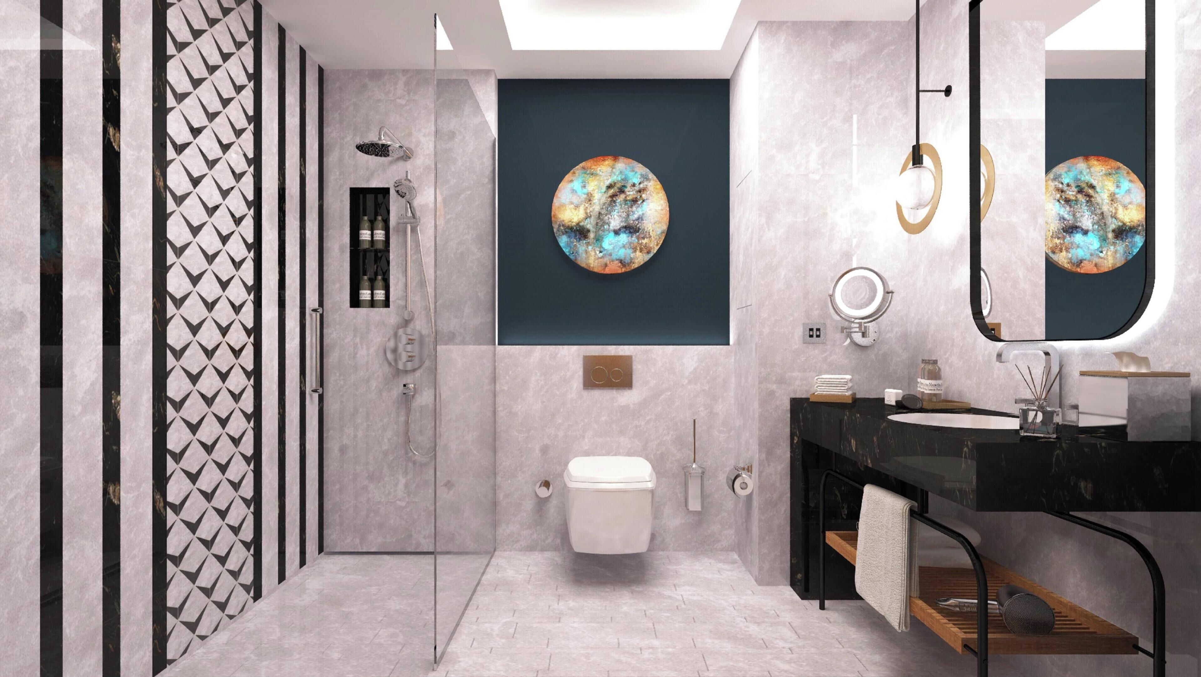 Un bagno moderno con cabina doccia in vetro, un water, un lavandino con specchio e due quadri circolari appesi al muro.