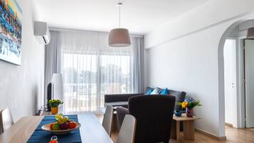 Apartment, 2 Bedrooms, Sea View | Living area | 32-inch flat-screen TV with cable channels, TV