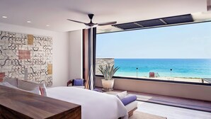 A bedroom with a large bed, a ceiling fan, a view of the ocean, and a potted plant. - Zadun Los Cabos, a Ritz-Carlton Reserve (San José del Cabo)