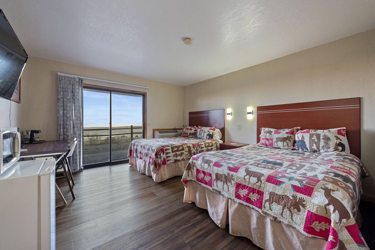 Standard 2 Queen beds | Blackout curtains, free WiFi, bed sheets