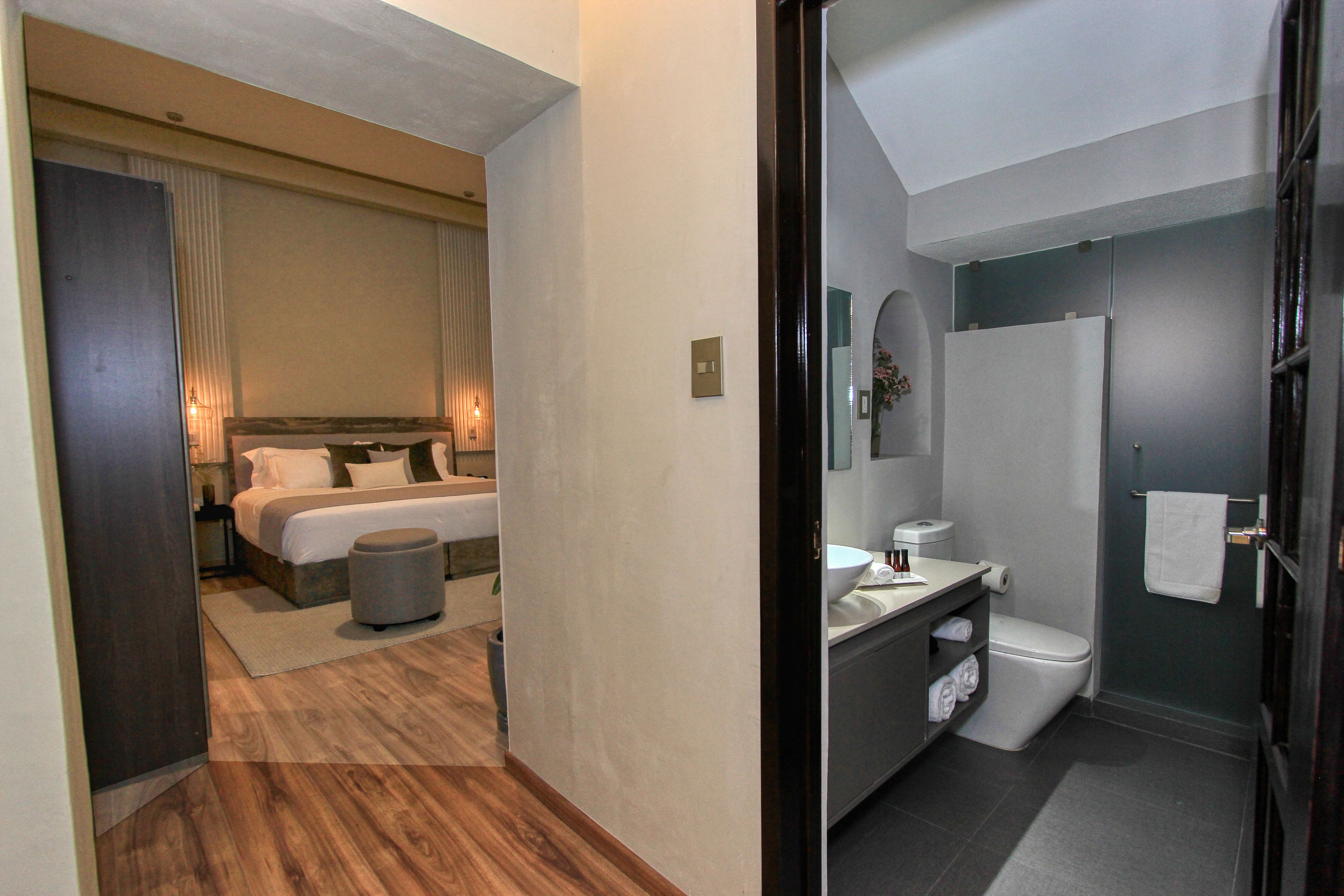 deluxe suite, 1 king bed (romero) | 1 bedroom, premium bedding, in-room safe, blackout curtains