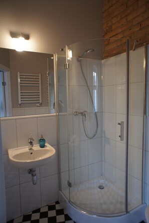 Apartment, 1 Queen Bed with Sofa bed (#51) | Bathroom | Shower, free toiletries, hair dryer, slippers