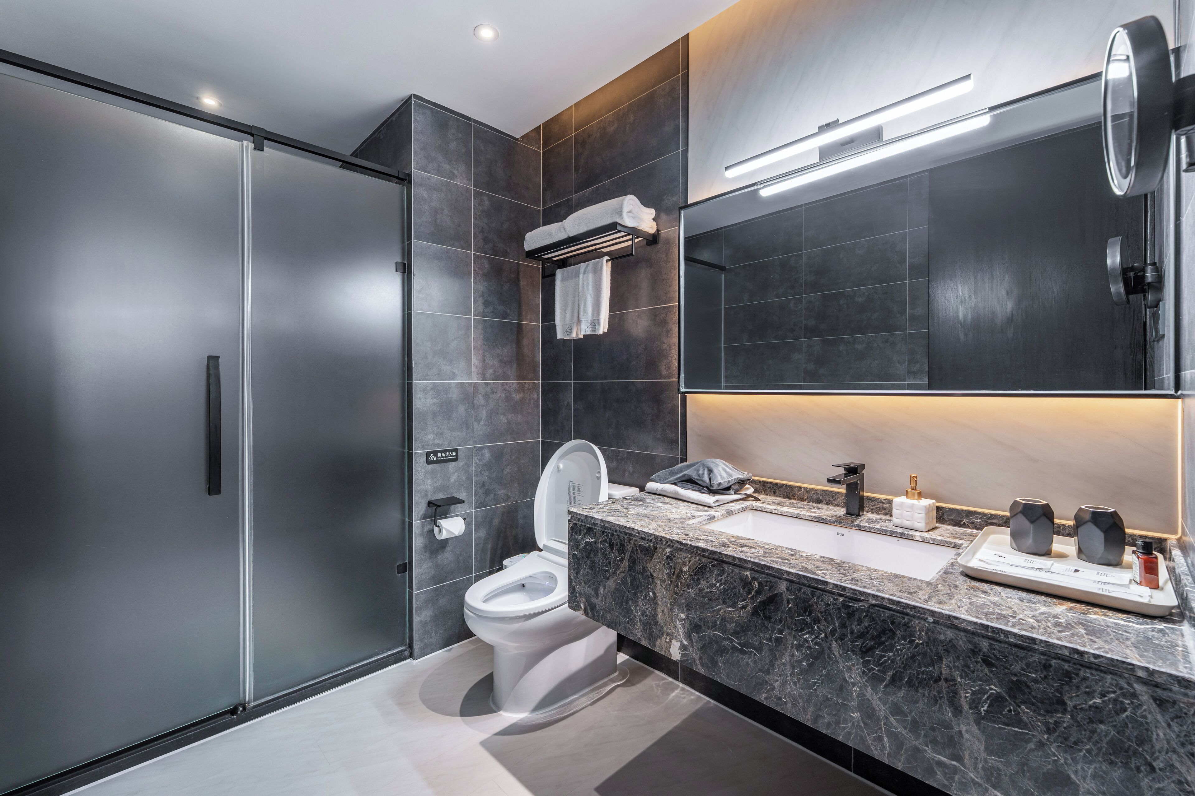 three-bedroom suite with three king beds | bathroom | shower, rainfall showerhead, free toiletries, hair dryer