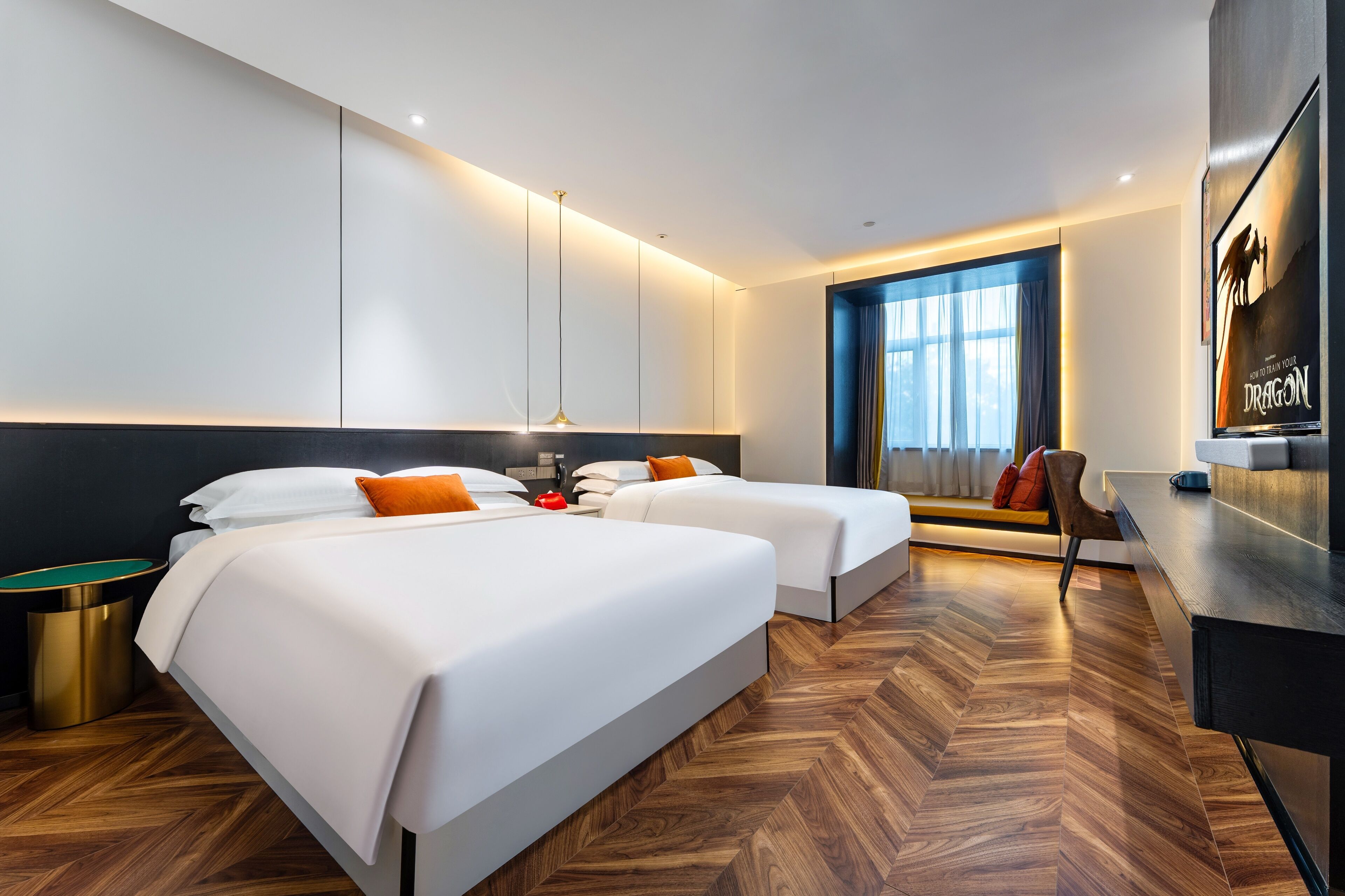 deluxe queen room with two queen beds | living area | flat-screen tv