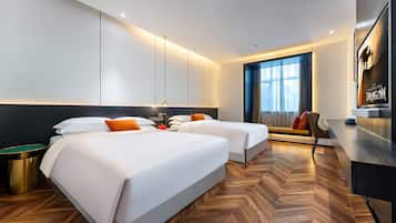 Deluxe Twin Room with Two Queen Beds | Living area | Flat-screen TV