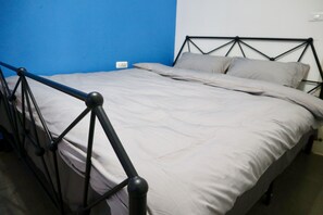 Two-Bedroom Apartment | Desk, blackout drapes, iron/ironing board, free WiFi