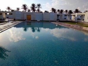 Outdoor pool, pool umbrellas, sun loungers