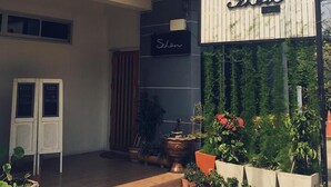A two-story building with a sign reading "Schön". - Schon (Chai Nat)