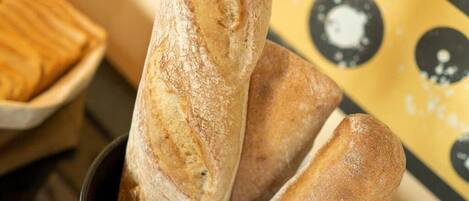 Three baguettes in a black bowl.