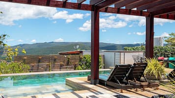 Outdoor pool, open 9:00 AM to 10:00 PM, pool umbrellas, pool loungers