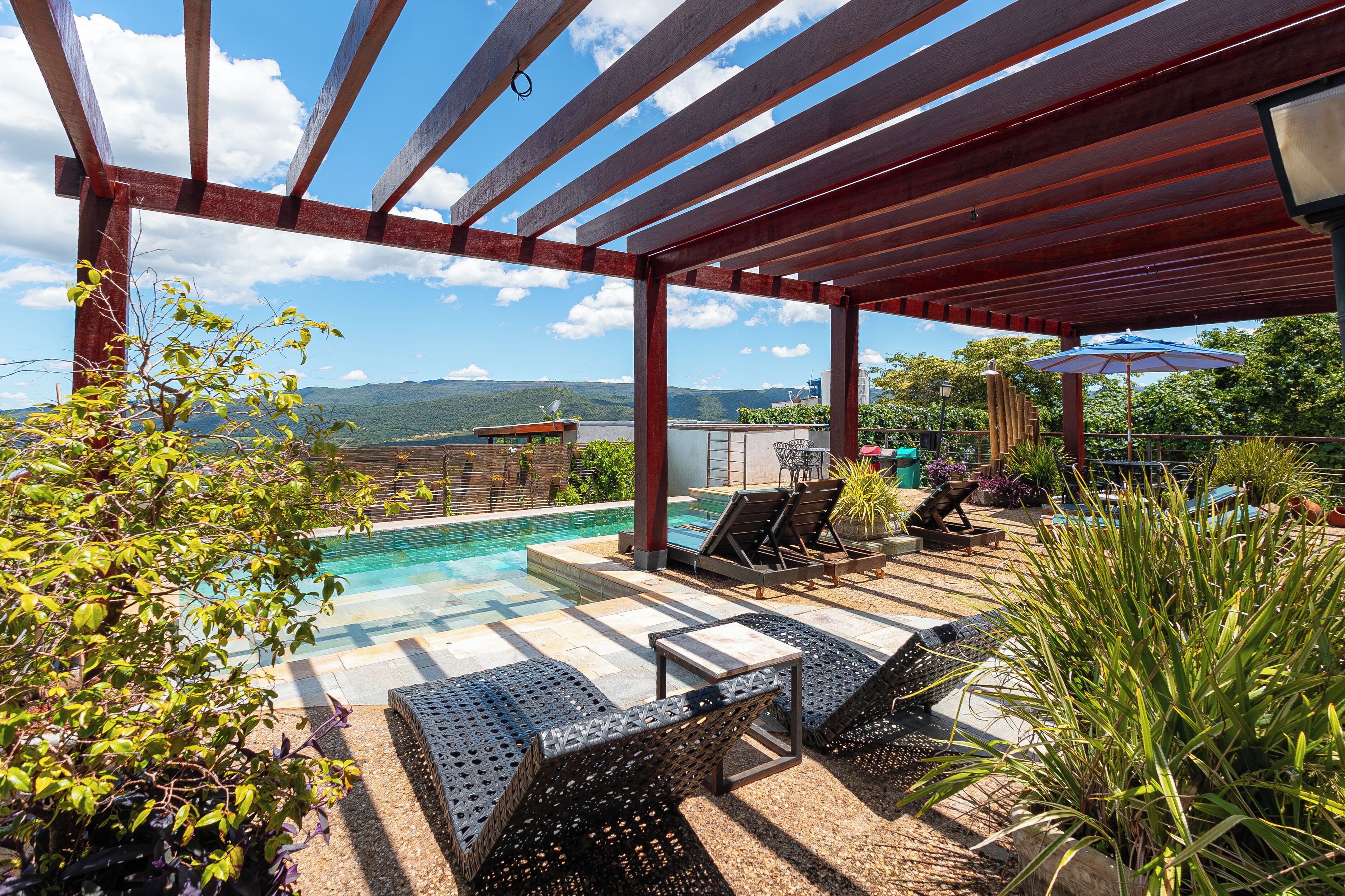 Outdoor pool, open 9:00 AM to 10:00 PM, pool umbrellas, pool loungers