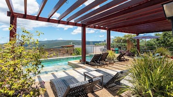 Outdoor pool, open 9:00 AM to 10:00 PM, pool umbrellas, pool loungers