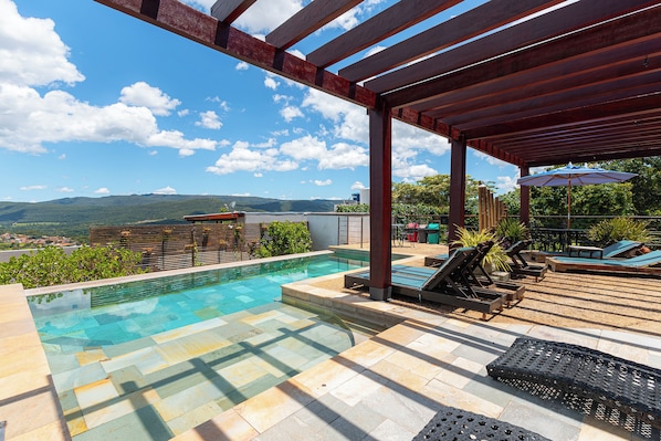 Outdoor pool, open 9:00 AM to 10:00 PM, pool umbrellas, pool loungers