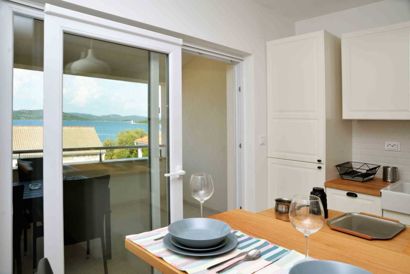 Apartment, Multiple Beds, Sea View | Private kitchen | Full-size fridge, oven, stovetop, dishwasher