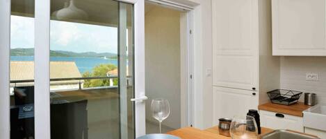 Apartment, Multiple Beds, Sea View | Private kitchen | Full-size fridge, oven, stovetop, dishwasher