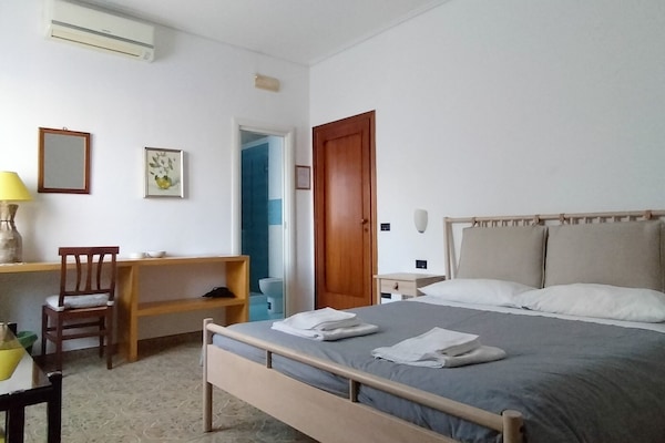 Down duvets, desk, laptop workspace, iron/ironing board