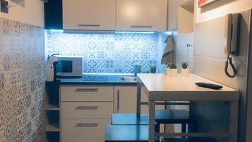 Full-sized fridge, microwave, stovetop, espresso maker