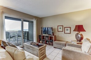 Condo, 2 Bedrooms | Living area | TV - Ocean View Condo Steps Away from Beach, Access to Salt Water Pool by RedAwning (Fernandina Beach)