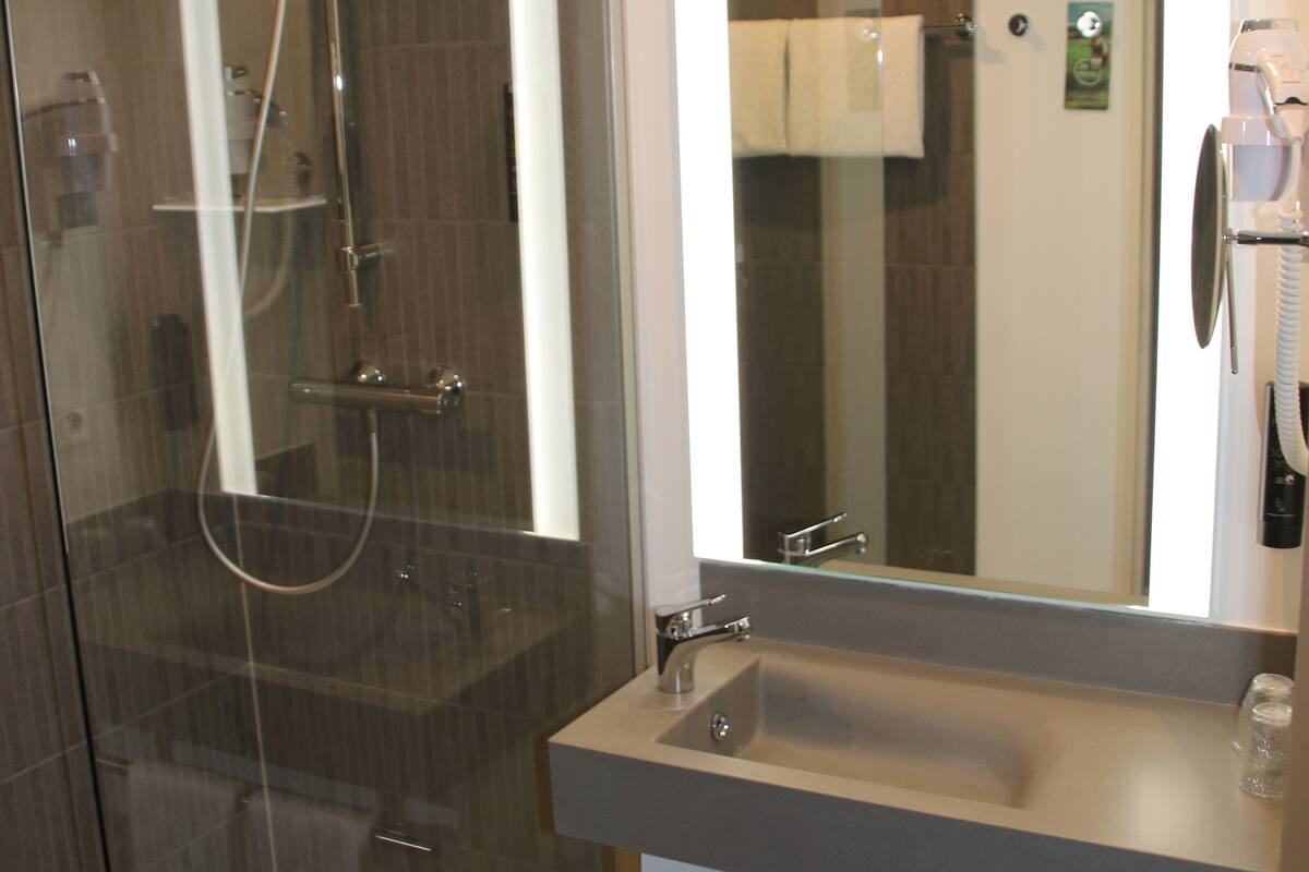 shower, eco-friendly toiletries, hair dryer, towels