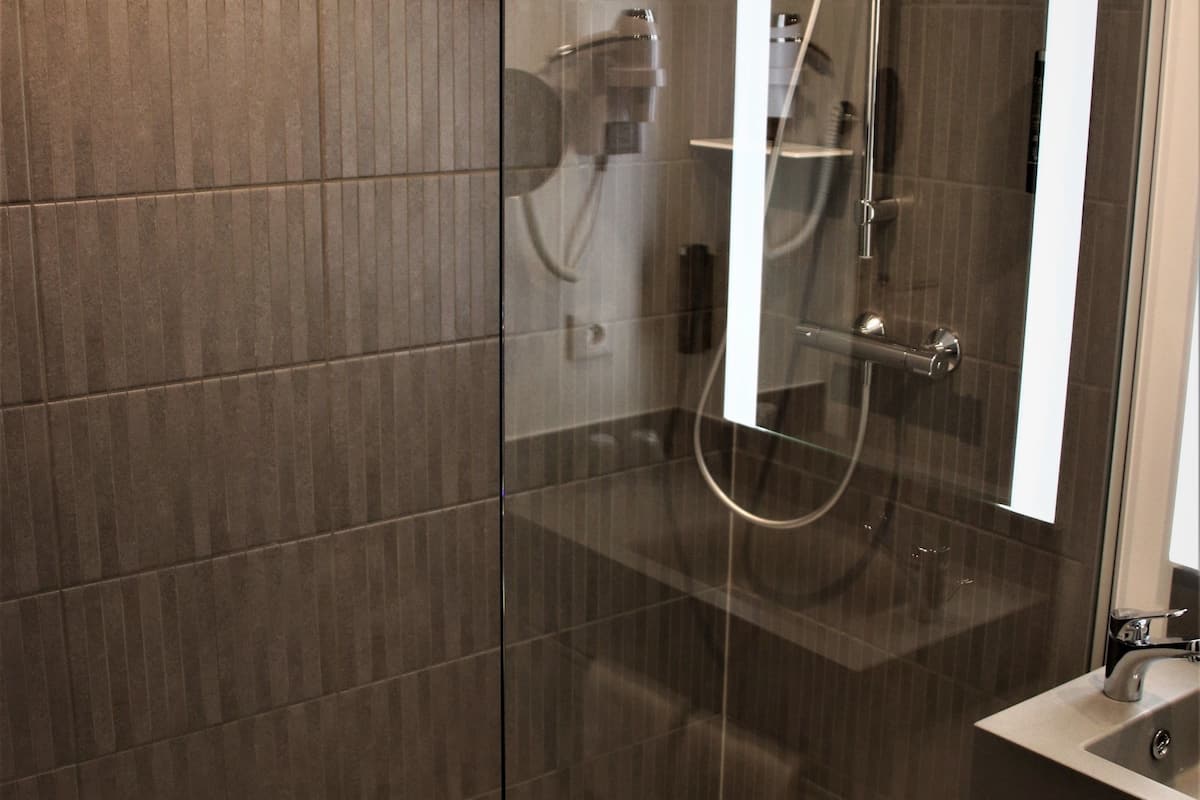 shower, eco-friendly toiletries, hair dryer, towels