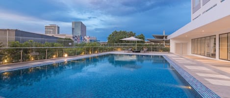 Outdoor pool, open 7:00 AM to 8:00 PM, pool umbrellas, pool loungers