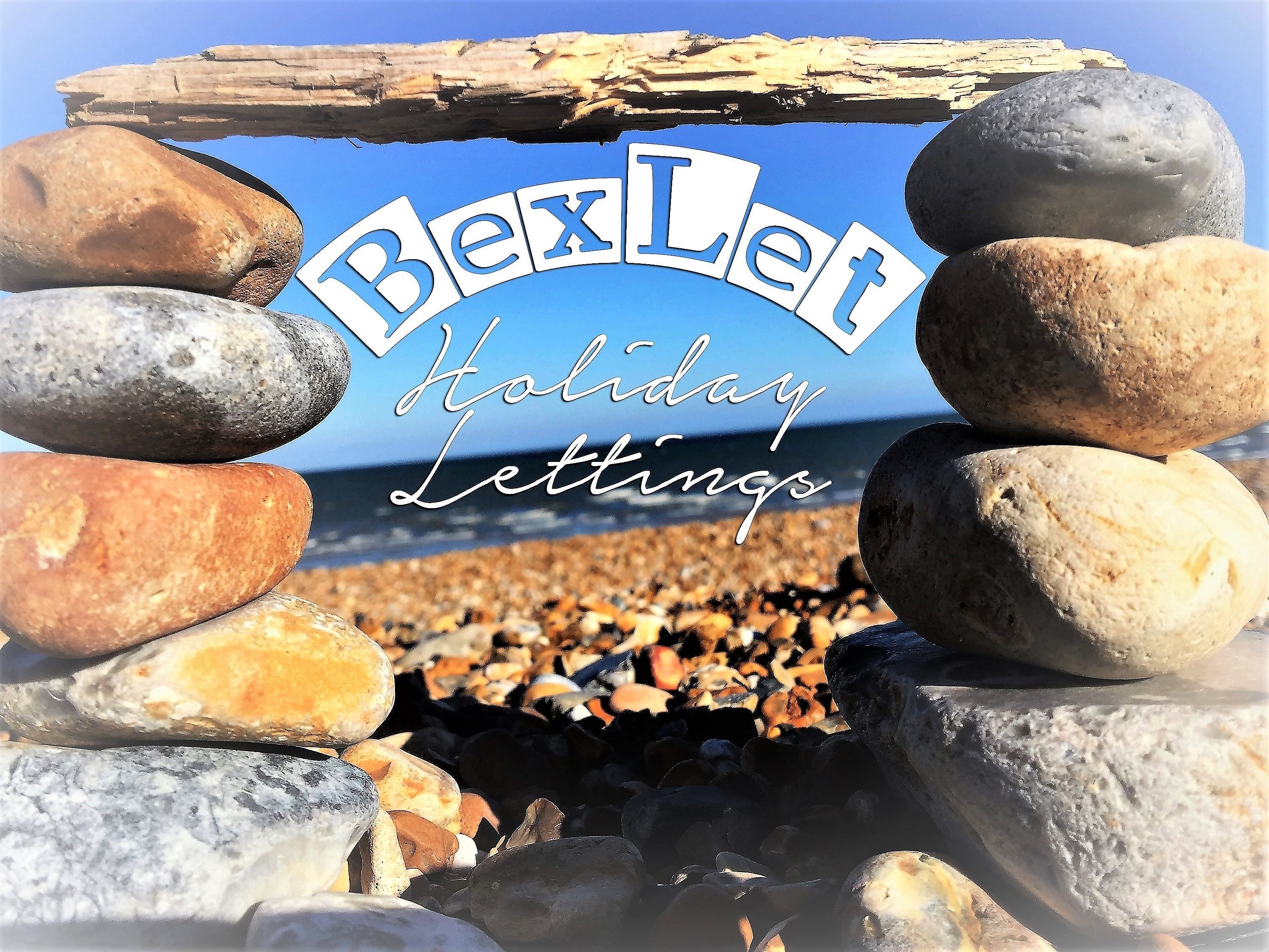 Una pila di pietre che forma un arco, con il testo "BexLet Holiday Lettings" al centro.