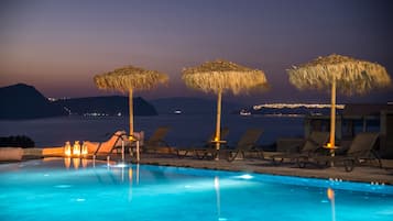 Seasonal outdoor pool, open 9:00 AM to 10:00 PM, pool umbrellas