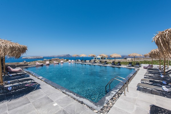 Seasonal outdoor pool, open 9:00 AM to 10:00 PM, pool umbrellas