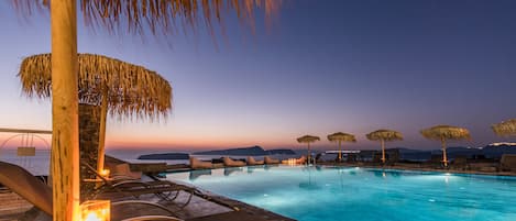 Seasonal outdoor pool, open 9:00 AM to 10:00 PM, pool umbrellas