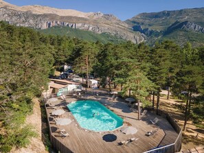 Seasonal outdoor pool, a heated pool, pool umbrellas, sun loungers