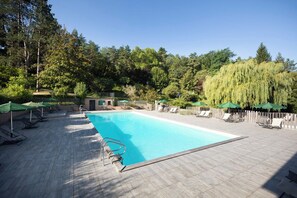 Indoor pool, seasonal outdoor pool, pool umbrellas, pool loungers