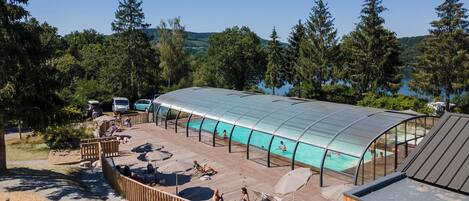Indoor pool, open 9:00 AM to 6:00 PM, pool umbrellas, pool loungers