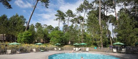 2 outdoor pools, a heated pool, pool umbrellas, pool loungers