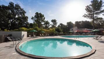 Seasonal outdoor pool, open 9:00 AM to 7:00 PM, pool umbrellas
